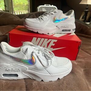 Women’s size 9 white/halo graphic stripe Nike sneaker. Brand new.